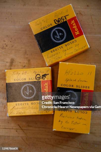 Boxes of previously unpublished images of Apollo 11 color slide film discovered by Michael Reese II at the Jamesburg Earth Station sit on his desk at...