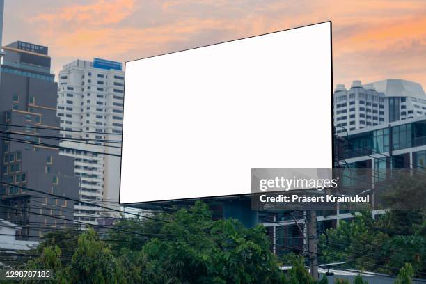 billboard on the background of the city. mock-up - blank poster stock pictures, royalty-free photos & images