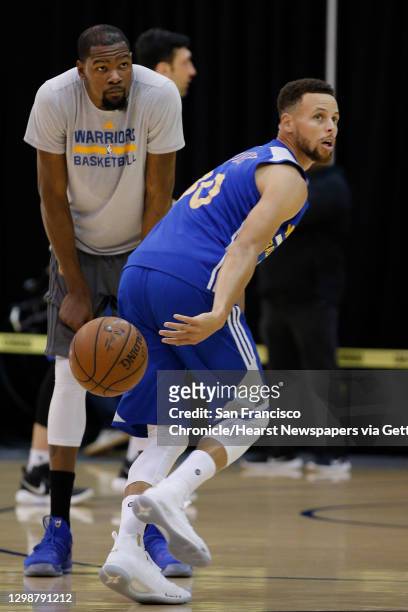 Golden State Warriors guard Stephen Curry and forward Kevin Durant practice together at the Warriors practice facility on Saturday, June 3 in...