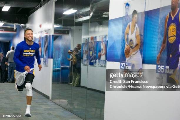 Golden State Warriors guard Stephen Curry runs through the Oracle Arena tunnel during his ritual pre-game warm up before Game 5 of the NBA Finals...