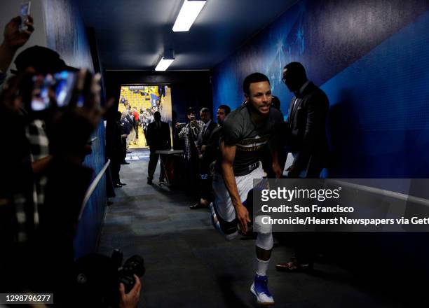 Stephen Curry sprints into the tunnel during his ritual warm up before Game 2 of the NBA playoffs between the Golden State Warriors and Portland...