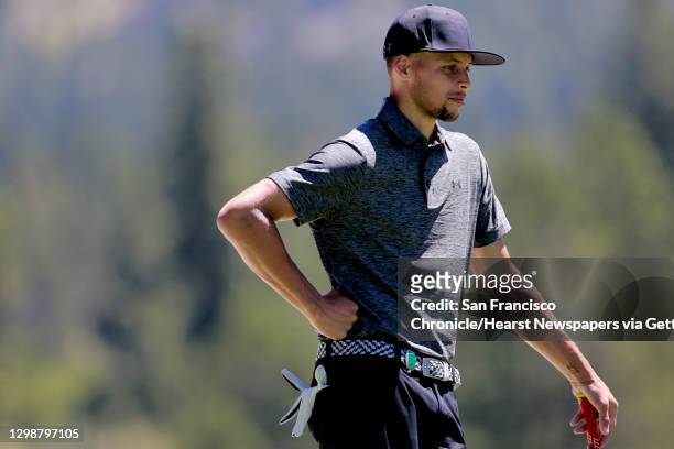 Golden State Warriors' Stephen Curry studies a putt during the 2016 American Century Celebrity-Amateur Tournament in Lake Tahoe, Nevada, California,...