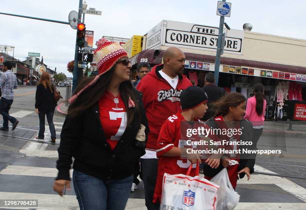 Fourty niner fans Sylvia Rios , her husband Henry Rios , and their children from San Bernardino visit Fisherman's Wharf in San Francisco, Calif., on...