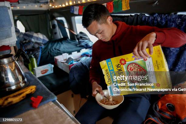 Frida Kahlo Way between Judson Avenue and Ocean Way) Jimmie Wu pours himself a bowl of Cheerios as he starts his day in his van on Tuesday, June 18...