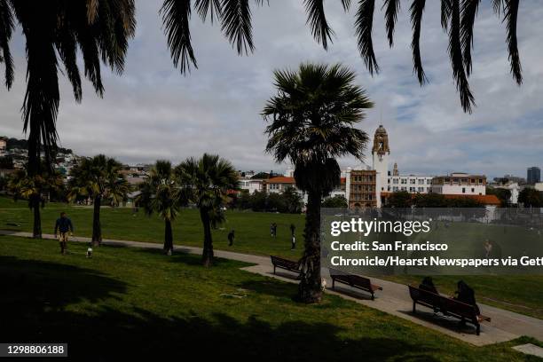 People enjoy Dolores Park in San Francisco, California, on Monday, May 13, 2019. Community residents have propsed to tax themselves to fund extra...