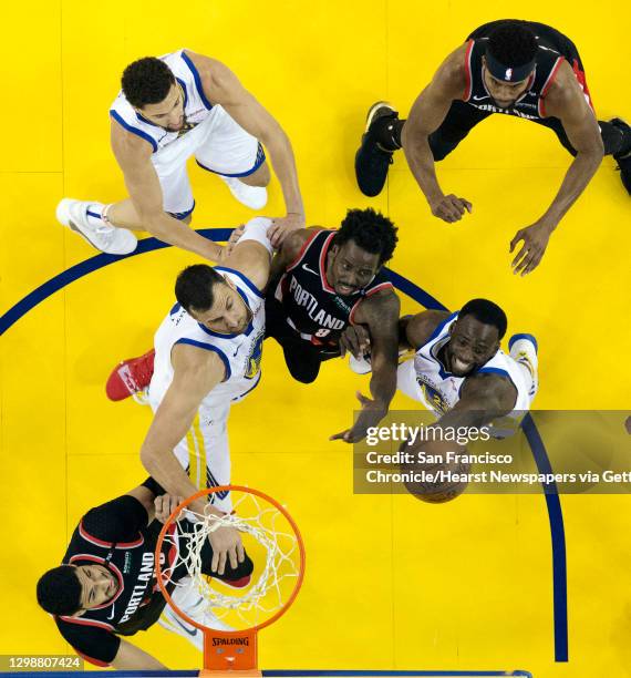 Draymond Green beats Al-Farouq Aminu to a rebound in the first half as the Golden State Warriors played the Portland Trailblazers in Game 1 of the...