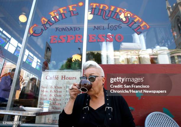 Paulette Baker, a longtime regular of Caffe Trieste, sips an Americano espresso in front of the venerable North Beach institution in San Francisco,...