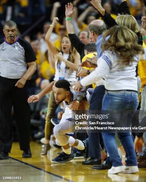 Golden State Warriors� Stephen Curry gets up after sliding into fans in the second quarter during game 1 of the Western Conference Finals between the...