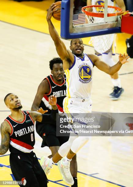Golden State Warriors� Andre Iguodala goes in for a layup ahead of Portland Trail Blazers� Damian Lillard and Al-Farouq Aminu in the third quarter...