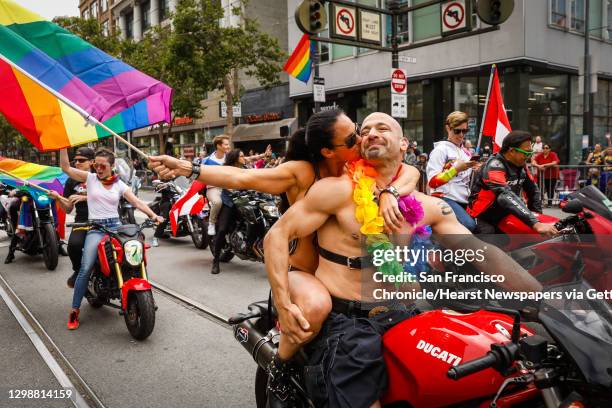 Amy Dabner embraces Adam Schindler at the start of the annual Gay Pride Parade in San Francisco, California, on Sunday, June 30, 2019.