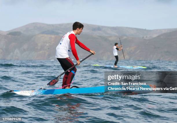 Second place winner Ryan Funk and third place finisher Travis Grant vie for position near the Golden Gate Bridge in the Red Bull Heavy Water stand-up...