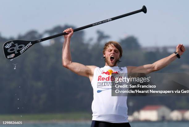 Casper Steinfath of Denmark exults after winning the Red Bull Heavy Water stand-up paddleboard race in San Francisco, Calif. On Friday Oct. 20, 2017....