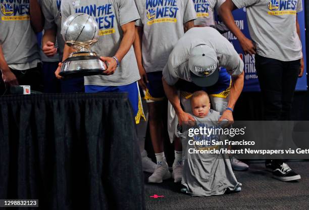 Golden State Warriors' Stephen Curry with son, Canon, after 119-117 overtime win over Portland Trail Blazers' in NBA Western Conference Finals' Game...