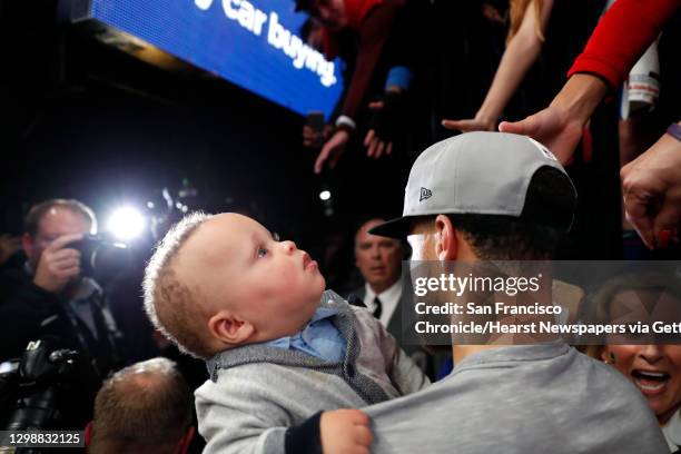 Golden State Warriors' Stephen Curry with son, Canon, after 119-117 overtime win over Portland Trail Blazers' in NBA Western Conference Finals' Game...