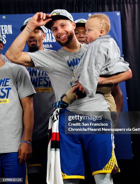 Golden State Warriors' Stephen Curry with son, Canon, after 119-117 overtime win over Portland Trail Blazers' in NBA Western Conference Finals' Game...