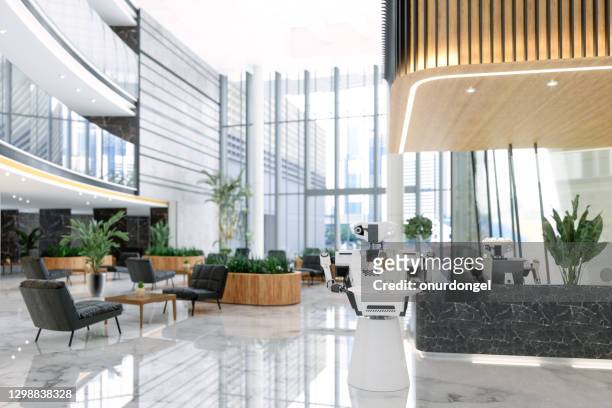 luxury hotel lobby with smart robots working as a receptionist and waiter. - lobby stock pictures, royalty-free photos & images
