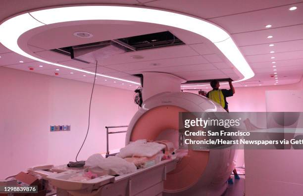 Philips field service engineer Ron Witschy works in the partially-finished Philips MRI room, which offers the ""ambient"" experience to patients July...