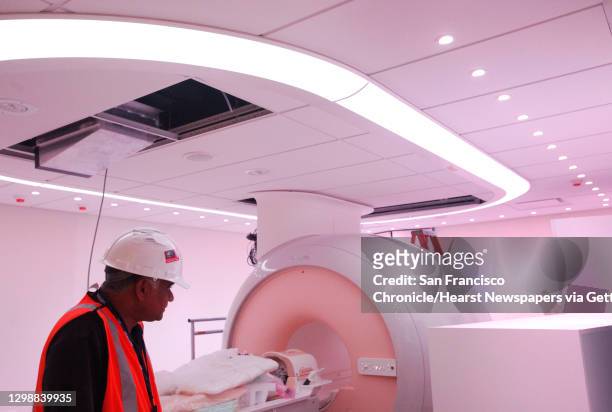 Philips field service engineer Kirit Patel works in the partially-finished Philips MRI room, which offers the ""ambient"" experience to patients July...