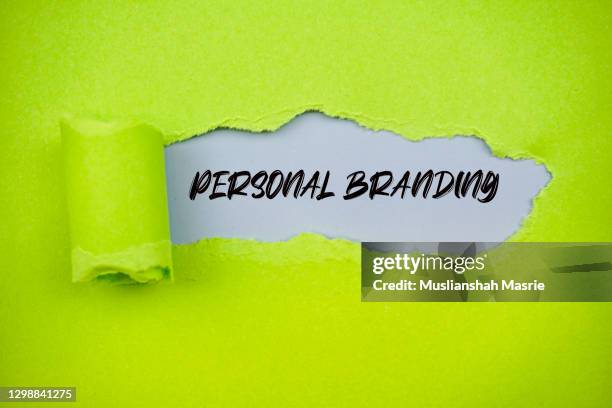 personal branding word on green torn paper. - inner courage stock pictures, royalty-free photos & images