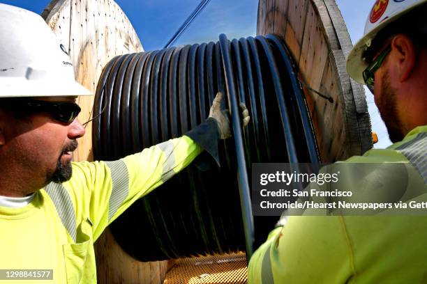 Lloyd Ratzlaff, and Richard Oakley with Pinnacle Power get set to install P.G. & E. Power lines underground as P.G. & E. Along Old County Rd. Near...