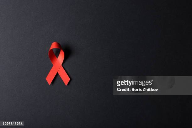 red awareness ribbon. - aids awareness ribbon stock pictures, royalty-free photos & images