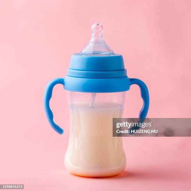baby bottle with milk - baby bottle stock pictures, royalty-free photos & images