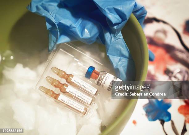 vaccine in storage of the freezer of the area covid-19 of the hospital. vials with ultra-cold vapour, close up. - dry ice storage stock pictures, royalty-free photos & images