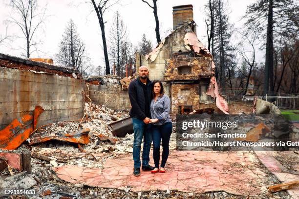 David Rivera and wife Chenoa Rivera pose for a portrait on one of their properties that was destroyed during the Camp Fire in Paradise, California,...