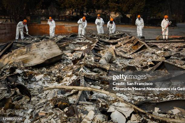 Search and Rescue crews from Oregon look for remains off of Edgewood Lane after the Camp Fire destroyed the town of Paradise, California, on Monday,...