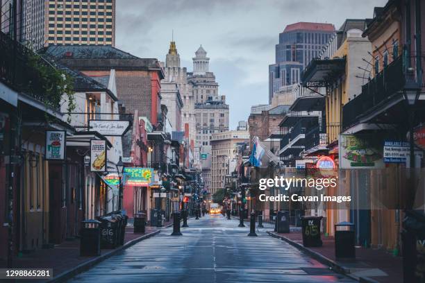 the famous bourbon street in new orleans without people in the morning - new orleans stock-fotos und bilder