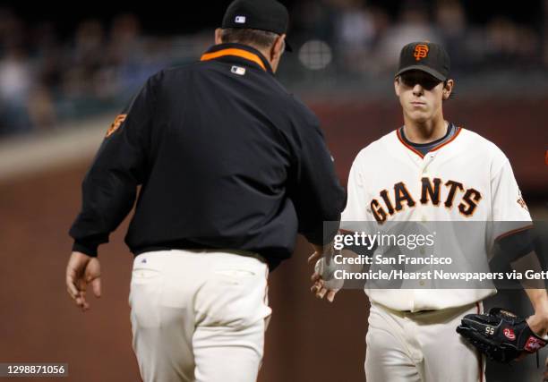 San Francisco Giants starting pitcher Tim Lincecum gives the ball to manager Bruce Bochy after he was relieved by Keiichi Yabu in the 5th inning...