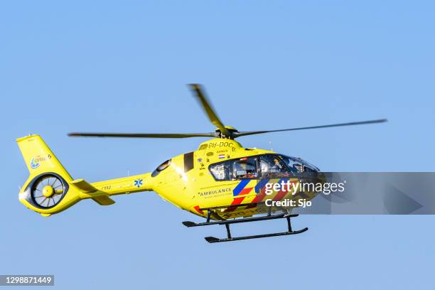 medical helicopter taking off from the scene of a severe accident on the n50 road - helicopter ambulance stock pictures, royalty-free photos & images