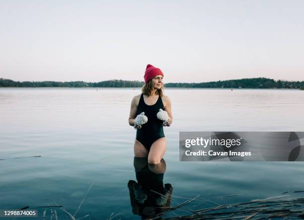 nordic woman stood on the baltic sea ready for cold water swimming - just do it fotografías e imágenes de stock