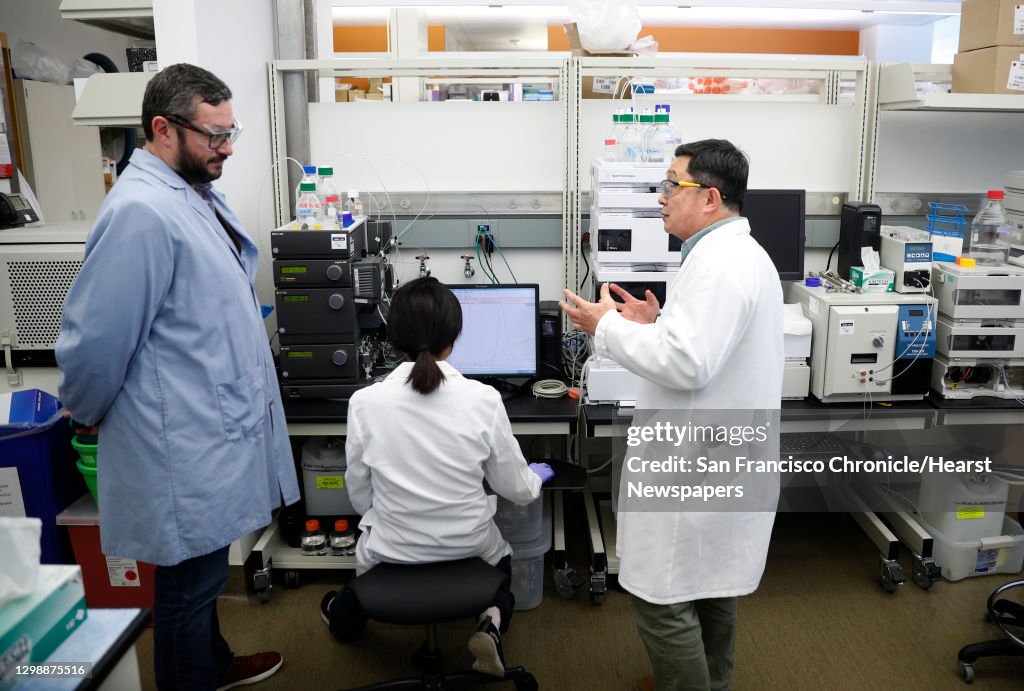 Jonathan Zalevsky, (left) chief science officer talks with protien chemists Yinyan Tang and Thomas Chang in the pharmaceutical lab at the headquarters of Nektar Therapeutics on Thursday Feb. 1, 2018, in San Francisco, Calif.