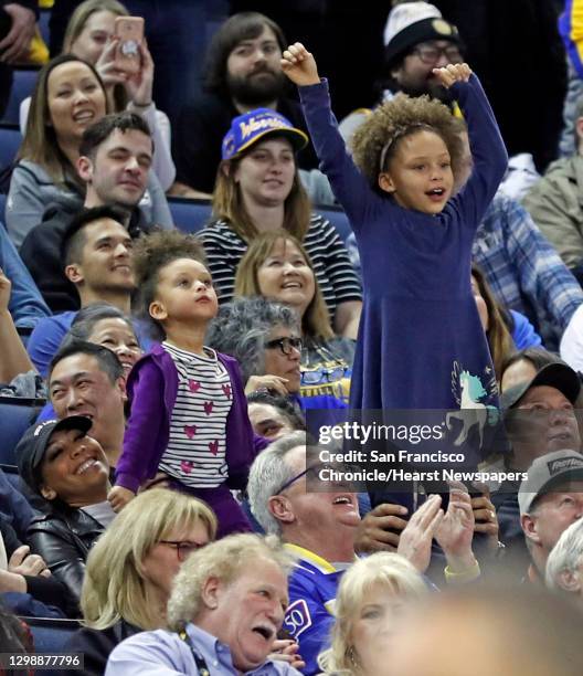Golden State Warriors' Stephen Curry's daughters Ryan and Riley dance during 4th quarter of Warriors' 115-108 win over Utah Jazz in NBA game at...