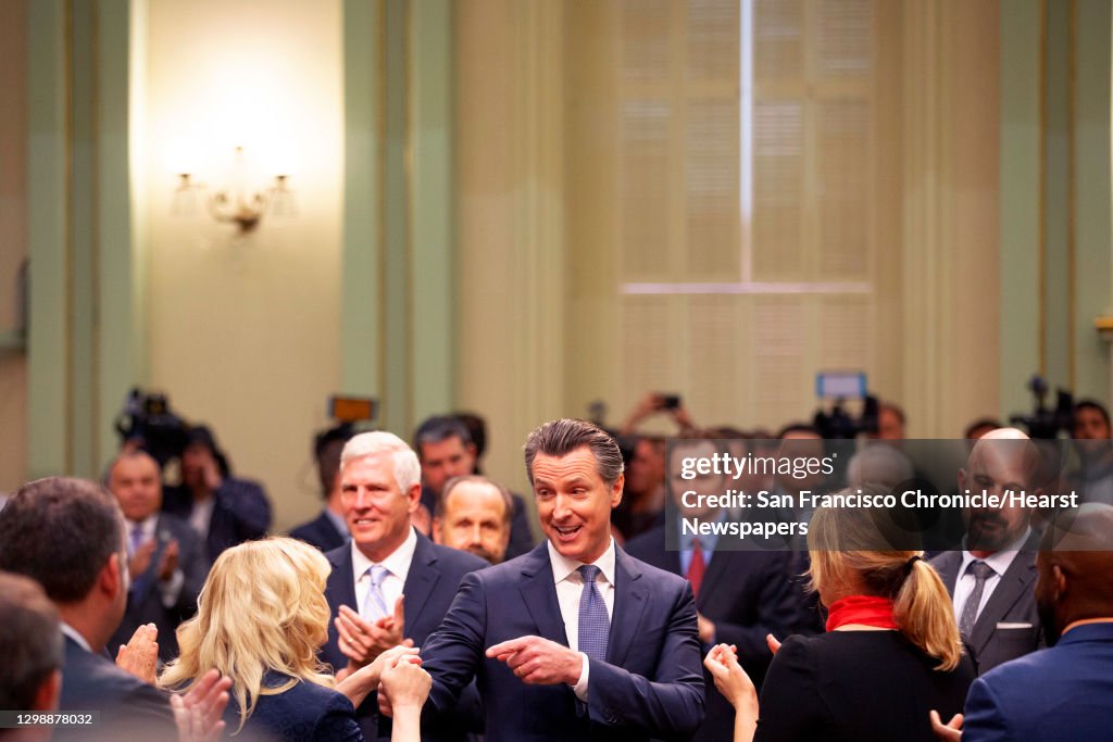 Gov. Gavin Newsom greets assembly members before he delivers the State of the State address at the California State Capitol on Tuesday, Feb. 12, 2019, in Sacramento.