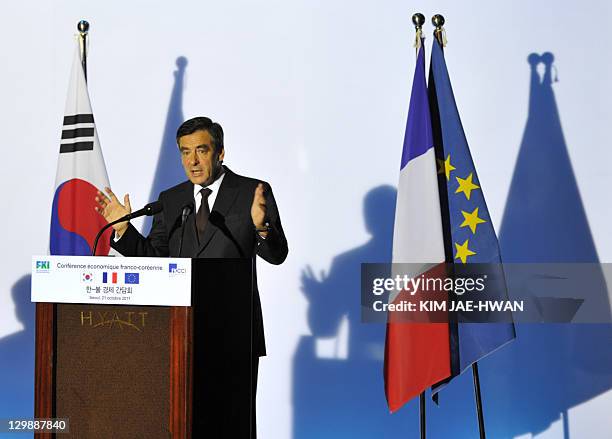 French Prime Minister Francois Fillon speaks to businessmen during a conference in Seoul on October 21, 2011. Fillon was to meet his South Korean...