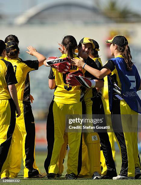 Jenny Wallace congratulates Gemma Triscari of the Fury after taking a catch to dismiss Sarah Coyte of the Breakers during the Women's Twenty20 match...