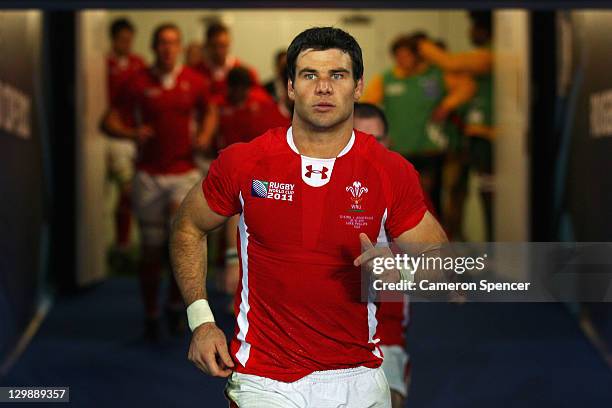 Mike Phillips of Wales runs out for the second half during the 2011 IRB Rugby World Cup bronze final match between Wales and Australia at Eden Park...