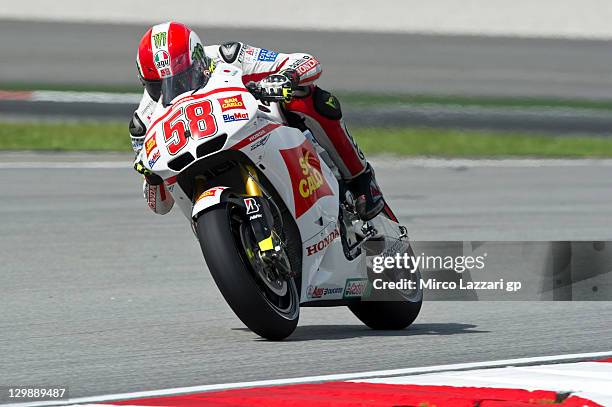 Marco Simoncelli of Italy and San Carlo Honda Gresini heads down a straight during the free practice for the MotoGP of Malaysia at Sepang Circuit on...