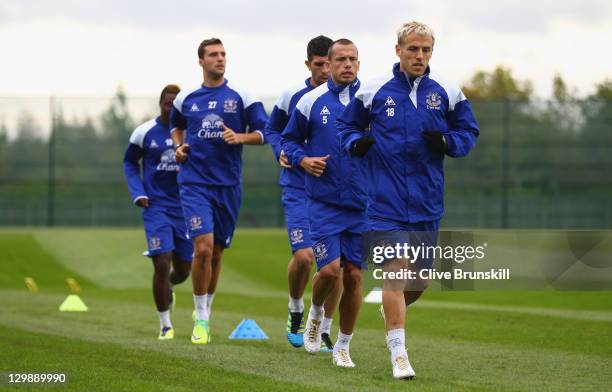 Phil Neville of Everton leads his team mates during an Everton training session at Finch Farm on October 21, 2011 in Liverpool, England.