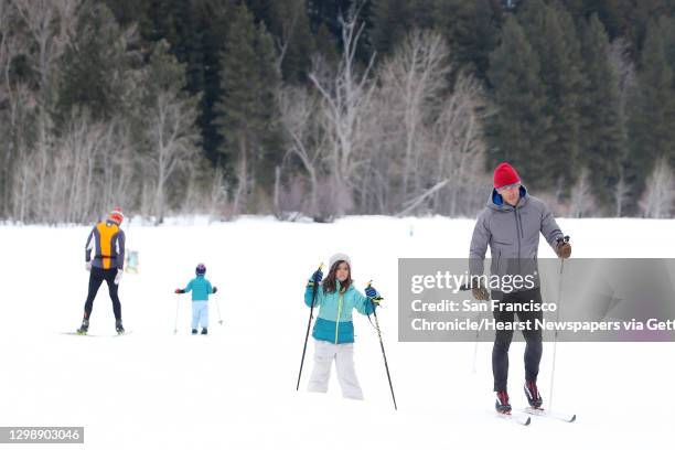 Cross-country skiers pass by on one of the 120 miles of groomed ski trails in Mazama maintained by the Methow Valley SportsTrails Association, March...