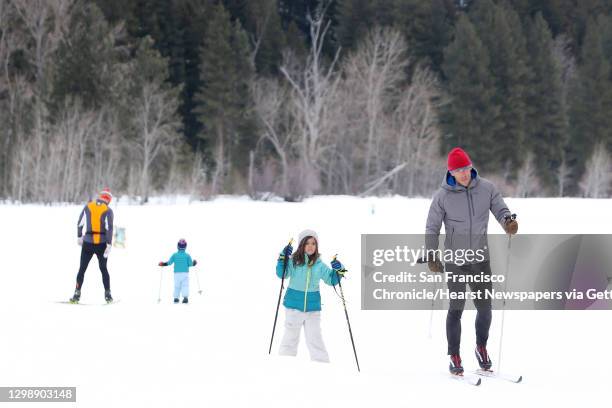Cross-country skiers pass by on one of the 120 miles of groomed ski trails in Mazama maintained by the Methow Valley SportsTrails Association, March...