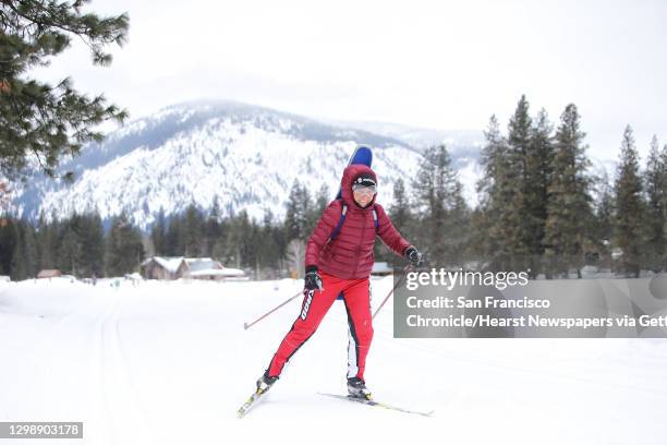 Cross-country skier passes by on one of the 120 miles of groomed ski trails in Mazama maintained by the Methow Valley SportsTrails Association, March...