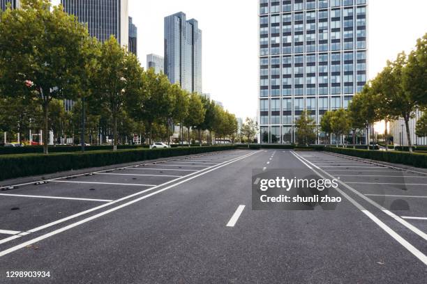 city financial district street at sunset - straßenmarkierung stock-fotos und bilder