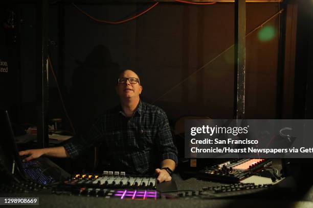 Laser theater supervisor Chris Harris looks up at the domed screen as he fiddles with the laser light controls at the Pacific Science Center, April...