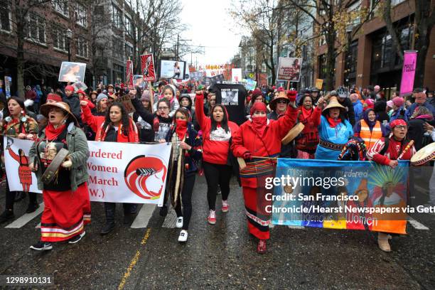 The families and friends of missing or murdered indigenous women lead the march as thousands poured through the streets of Seattle, from Cal Anderson...