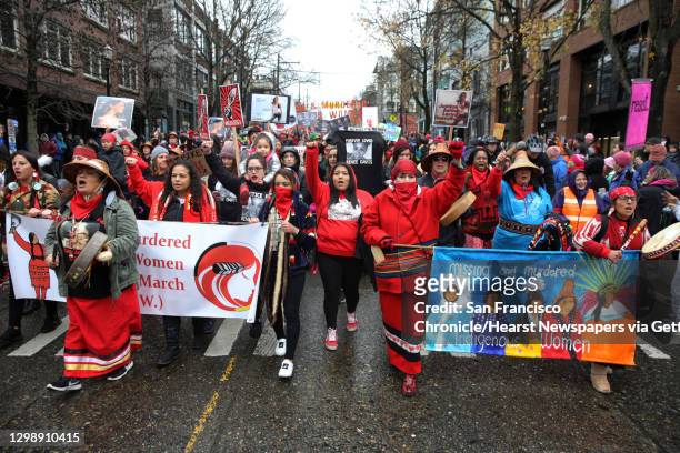 The families and friends of missing or murdered indigenous women lead the march as thousands poured through the streets of Seattle, from Cal Anderson...