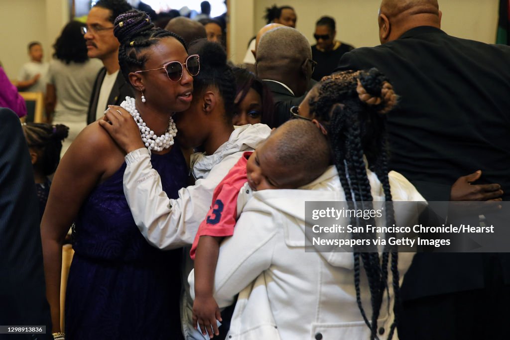 Charleena Lyles' younger sister Tiffany Rogers, left, hugs family members after Lyles' funeral at New Hope Missionary Baptist Church, Monday, July 10, 2017. (Genna Martin, seattlepi.com)