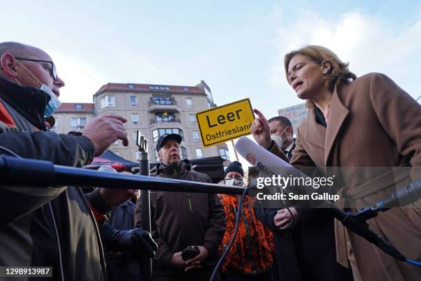 German Agriculture and Consumer Protection Minister Julia Kloeckner debates with protesting farmers in front of the Federal Agriculture Ministry,...